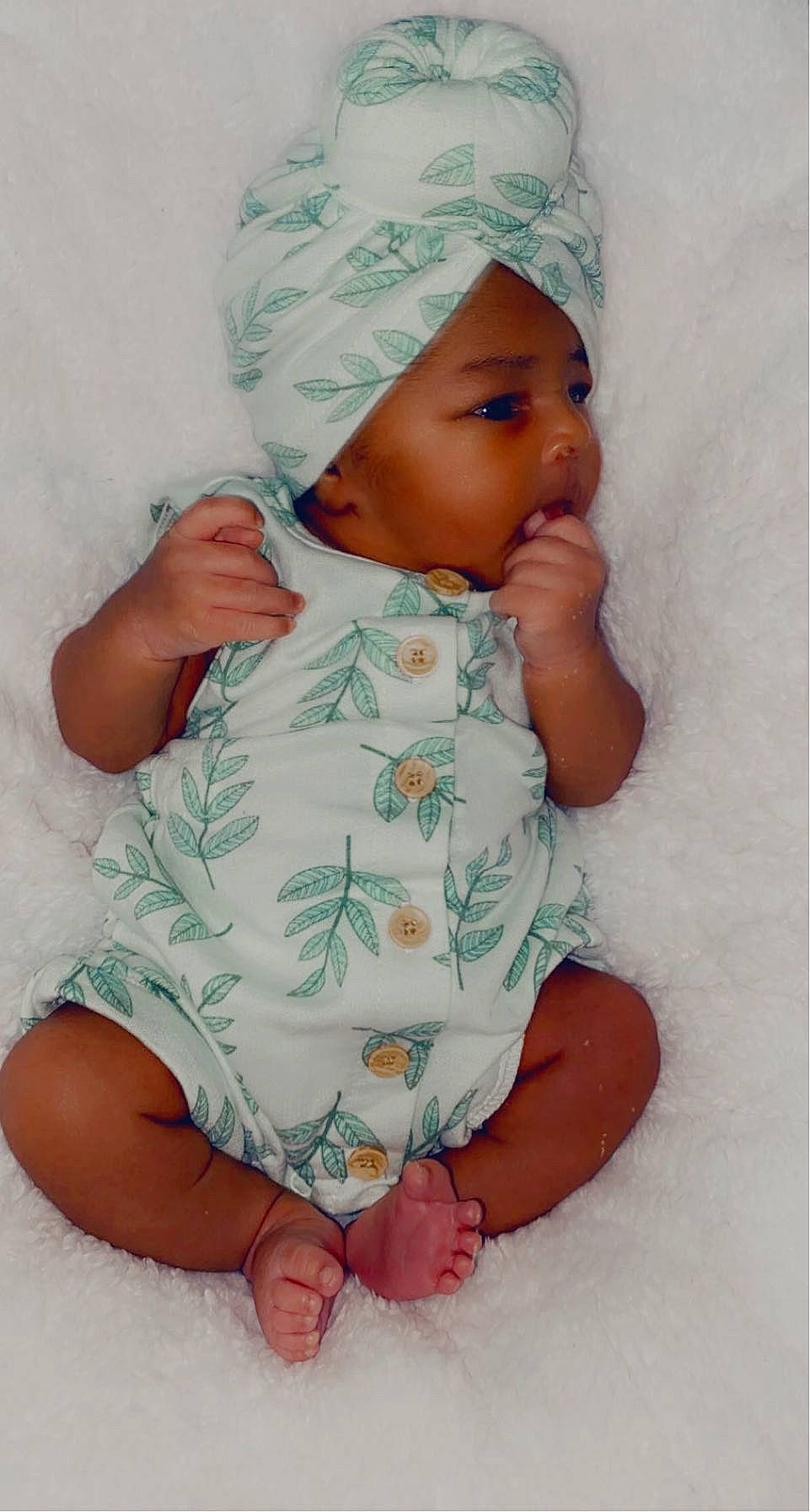 Kehlani is registered to the contest to win money with this photo: baby, baby_sleeping, baby_toddler_clothing, cap, cheek, child, comfort, eye, face, finger, headgear, headwear, linens, lip, person, pink, product, skin, sleeve, textile