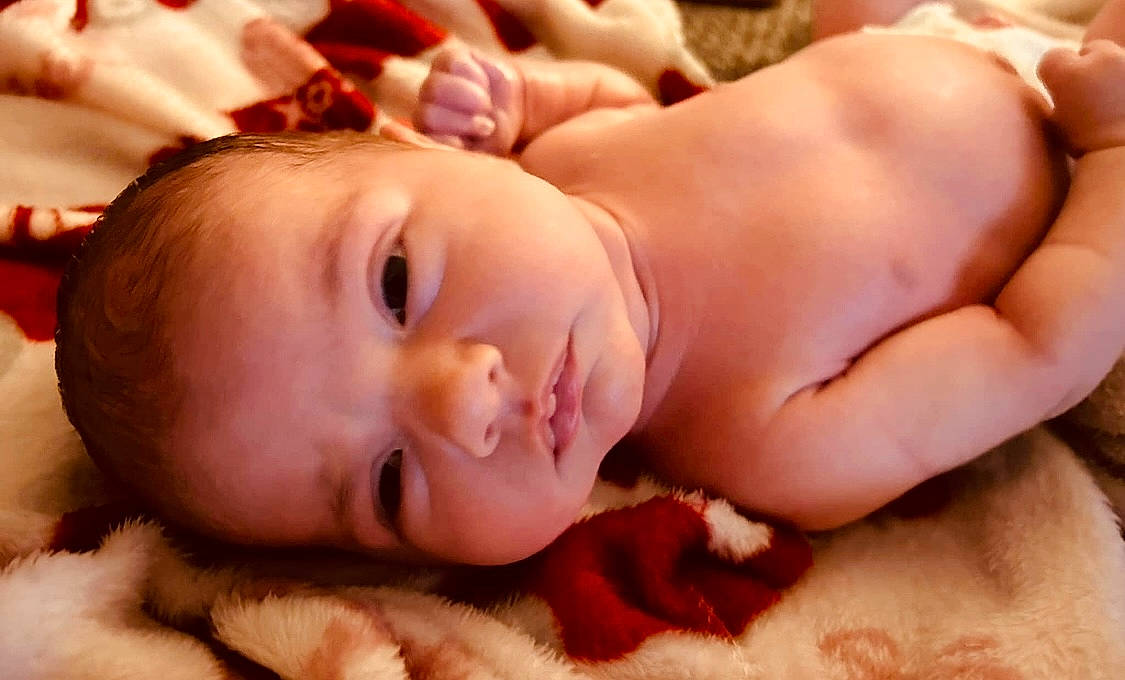 Alexis is registered to the contest to win money with this photo: baby, cheek, chin, comfort, eye, eyebrow, eyelash, face, finger, hair, happy, head, iris, lip, mouth, muscle, neck, nose, person, skin