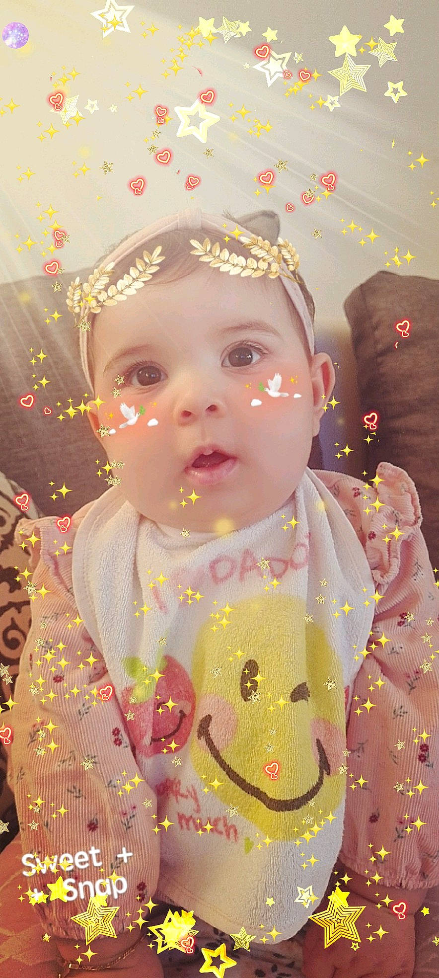 Camélia participe au concours pour gagner de l'argent avec cette photo : baby, baby_toddler_clothing, cheek, child, chin, dress, event, facial_expression, fun, hairstyle, happy, human, lip, pattern, person, pink, skin, sleeve, surprise, textile