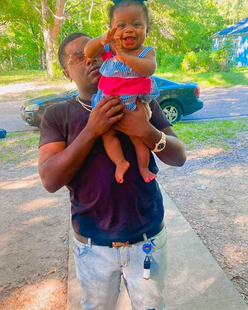 Harley Gibson joined the competition — help win amazing prizes! car, electric_blue, face, fun, gesture, grass, green, hair, happy, human_body, leisure, person, plant, recreation, red, summer, t_shirt, thumb, toddler, tree