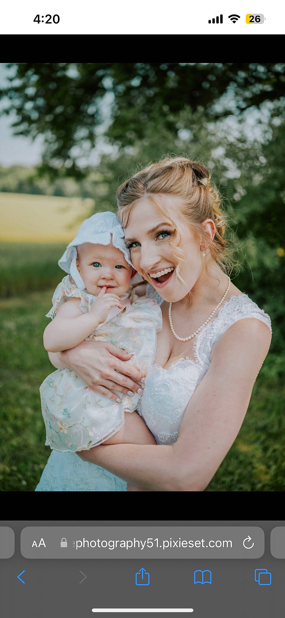 Rose is registered to the contest to win money with this photo: baby, blond, bridal_clothing, child, event, face, flash_photography, fun, gesture, grass, happy, headwear, iris, jewellery, joy, love, people_in_nature, person, plant, sitting