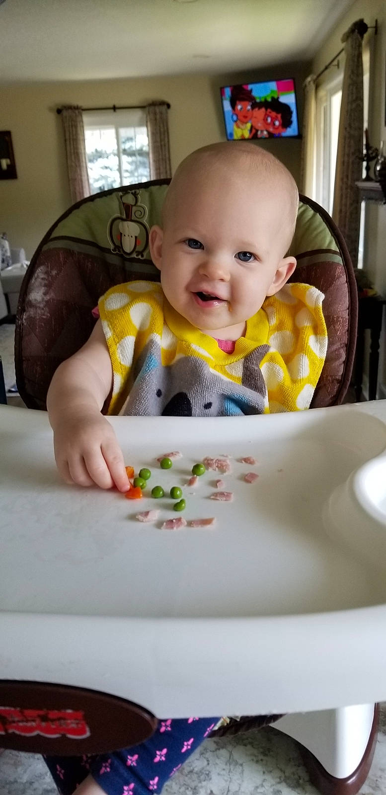 Rose joined the competition — help win amazing prizes! baby, baby_playing_with_food, baby_toddler_clothing, bib, chair, cheek, child, comfort_food, dishware, food_craving, happy, person, picture_frame, room, sitting, skin, sleeve, smile, t_shirt, toddler