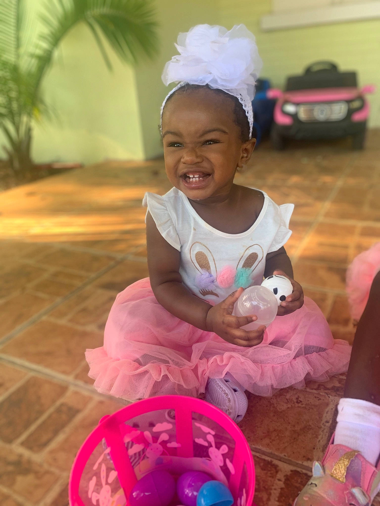 Basily joined the competition — help win amazing prizes! child, event, facial_expression, fun, happy, landscape, leisure, magenta, morning, palm_tree, person, pink, plant, recreation, sandal, sitting, skin, smile, toddler, toy