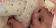 Adelynn joined the competition — help win amazing prizes! baby, infant, teddy_bear, stuffed_animal, pink_dress, headband, flower, cute, child, hugging, soft_toy, blanket, fabric, patterned, floral, closeup, indoors, portrait, adorable, sleepy