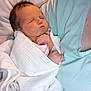 Emily Rose is registered to the contest to win money with this photo: architecture, baby, bed, bedroom, blanket, building, clothing, face, furniture, glove, head, hospital, indoors, newborn, person, photography, portrait, quilt, room, sleeping