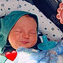 Ashton is registered to the contest to win money with this photo: baby, infant, sleeping, car_seat, blanket, pacifier, hat, child, cute, cozy, happy, peaceful, smile, face, soft, warm, indoors, resting, love, red_heart