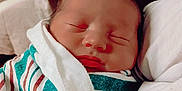 Ashton joined the competition — help win amazing prizes! newborn, baby, sleeping, blanket, striped, wrapped, pillow, pattern, indoor, face, peaceful, child, infant, rest, cozy, soft, closeup, portrait, person, cute
