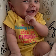 Karsyn Renee Horton is registered to the contest to win money with this photo: baby, blanket, candid, child, closeup, cozy, cute, expression, face, hand, happy, indoors, infant, playful, portrait, sitting, smiling, soft, yellow_onesie, young_child