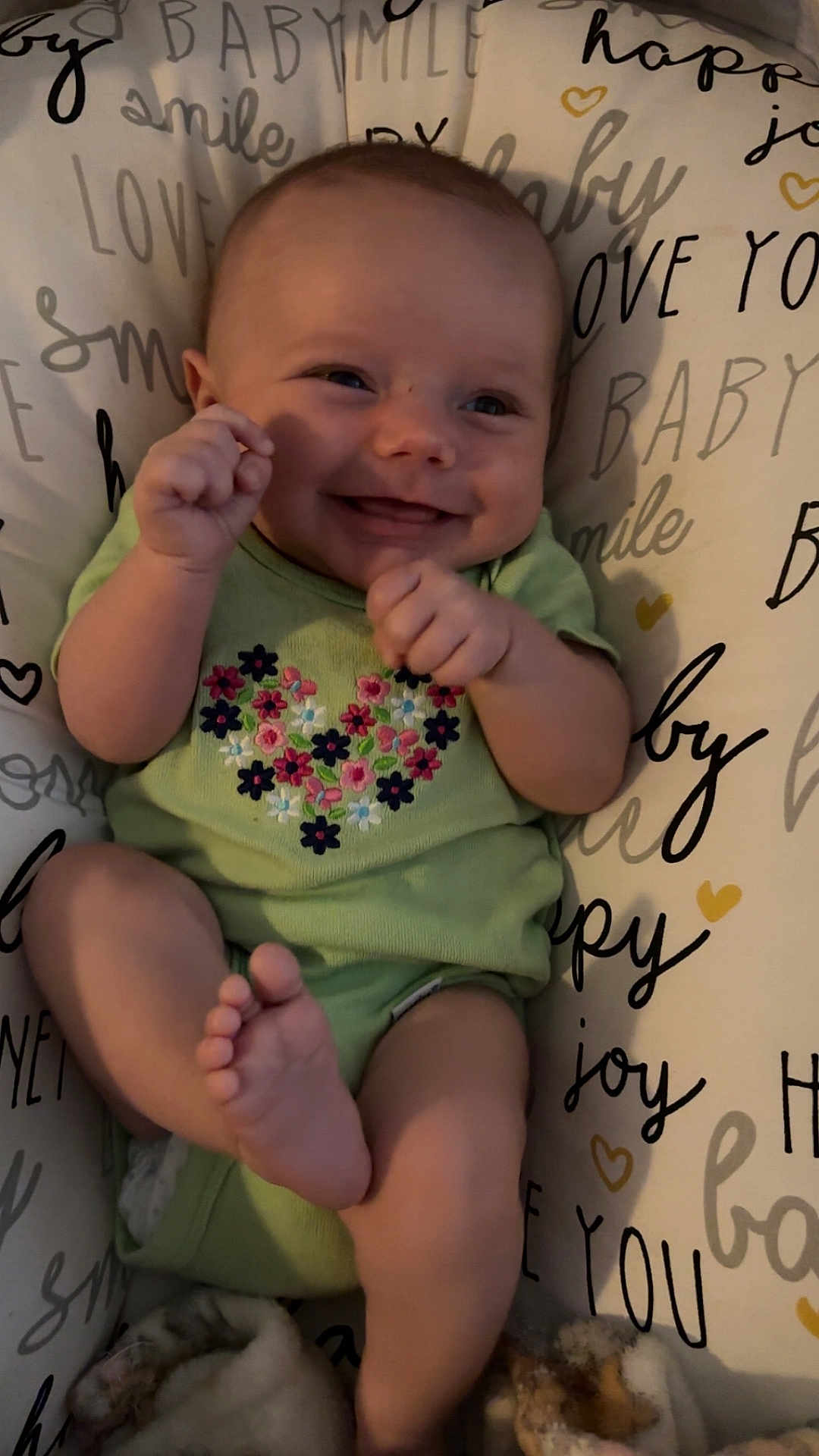 Karsyn Renee Horton joined the competition — help win amazing prizes! baby, blanket, child, cushion, cute, face, floral_pattern, foot, green_onesie, hand, happy, indoors, infant, joy, love, playful, portrait, smiling, soft_toy, text_background