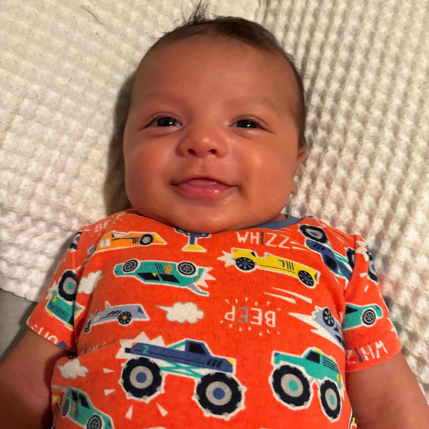 Marlow is registered to the contest to win money with this photo: applique, baby, bodypart, clothing, couch, cushion, face, finger, furniture, hand, happy, head, homedecor, newborn, person, photography, portrait, shirt, smile, t_shirt