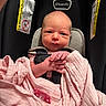 newborn, baby, car_seat, blanket, pink, pacifier, infant, straps, clothing, face, hand, closeup, indoor, child, person, safety, seat, infant_care, wrapped, cute