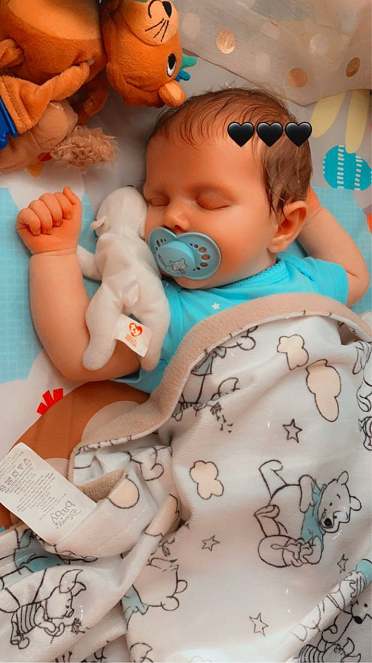 Hadley is registered to the contest to win money with this photo: aqua, azure, baby, baby_sleeping, blue, cheek, child, comfort, finger, human, joint, mouth, organ, person, photograph, product, skin, textile, toddler, toy