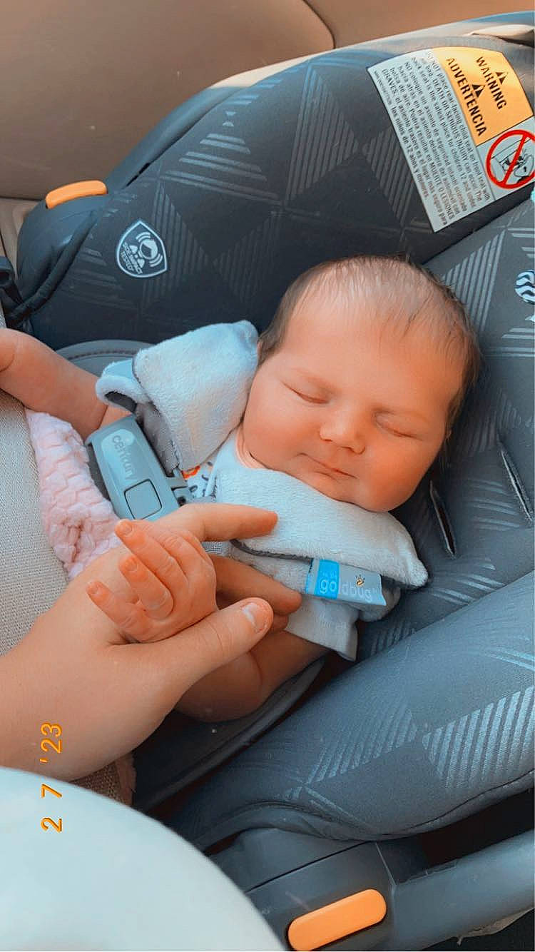 Hadley is registered to the contest to win money with this photo: auto_part, baby, baby_carriage, baby_in_car_seat, baby_products, baby_sleeping, baby_toddler_clothing, beauty, car_seat, cheek, child, comfort, electric_blue, finger, nail, person, product, seat_belt, skin, thumb