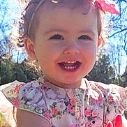 Michelle Shelly joined the competition — help win amazing prizes! toddler, child, smiling, outdoor, sunlight, bow, curly_hair, floral_dress, clapping, happy, portrait, nature, trees, blue_sky, cute, baby, person, daylight, spring, innocence