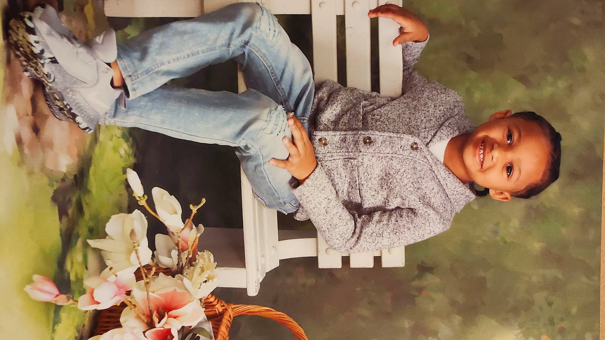 Harrison joined the competition — help win amazing prizes! chair, child, event, flower, flower_arranging, fun, gesture, grass, happy, human_body, human_leg, joy, orange, person, petal, plant, sitting, smile, spring, textile