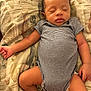 Tyhir is registered to the contest to win money with this photo: baby, sleeping, infant, striped_onesie, blanket, pattern, fish_pattern, socks, cute, peaceful, resting, child, human, indoors, soft_lighting, closeup, newborn, relaxing, lying_down, toddler