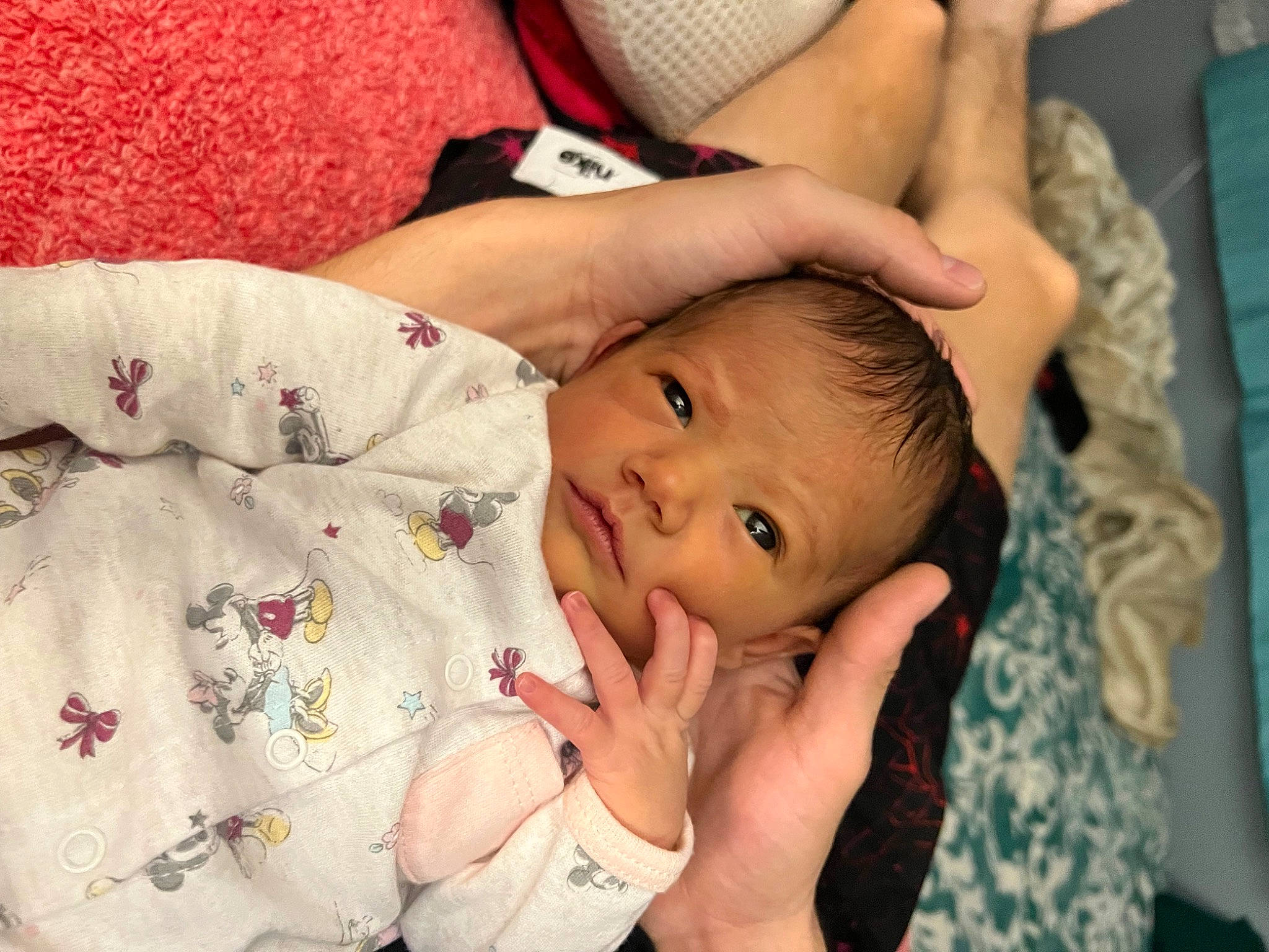 Nalani is registered to the contest to win money with this photo: baby, baby_toddler_clothing, cheek, comfort, elbow, eye, eyelash, finger, gesture, hand, happy, human_body, lip, mouth, nail, nose, person, skin, textile, thumb