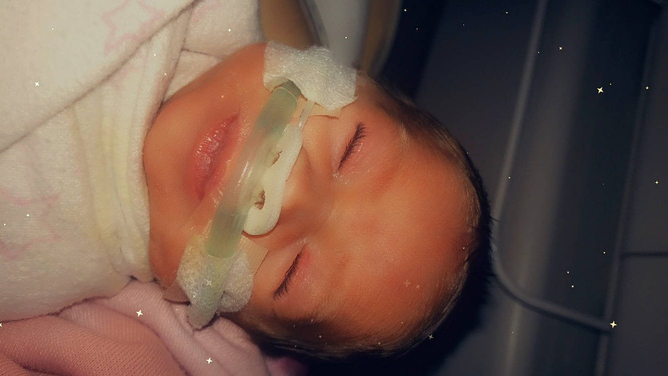 Keilani is registered to the contest to win money with this photo: baby, bathing, chest, ear, eye, eyelash, finger, headgear, helmet, human_body, iris, jaw, lip, mouth, nose, person, skin, smile, sunglasses, toddler