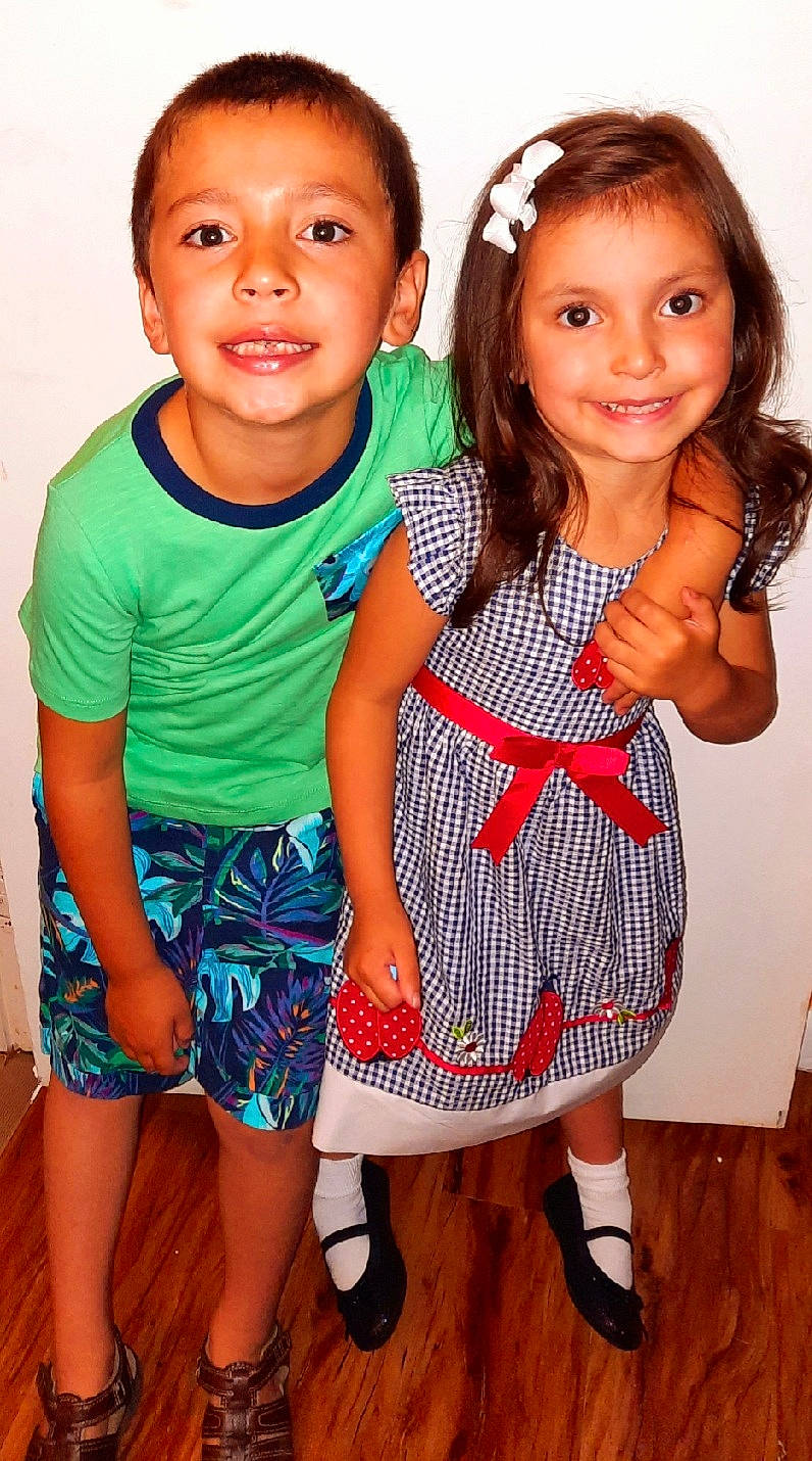 Joseph is registered to the contest to win money with this photo: baby_toddler_clothing, dress, eye, face, facial_expression, gesture, hair, hairstyle, hand, happy, head, human_body, joint, joy, leg, person, shoulder, skin, sleeve, smile