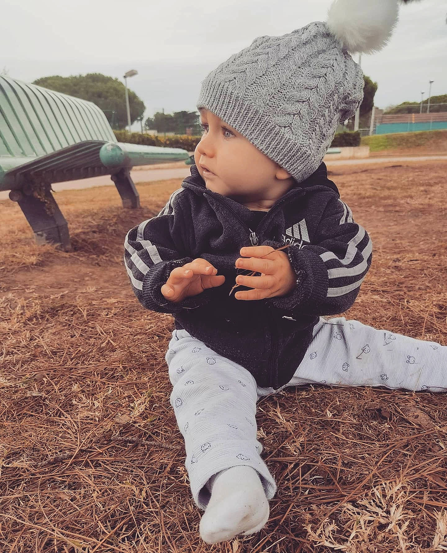 Kaylan participe au concours pour gagner de l'argent avec cette photo : baby, beanie, bonnet, cap, child, cool, fun, headgear, headwear, knit_cap, person, photography, play, sitting, smile, soil, toddler, winter