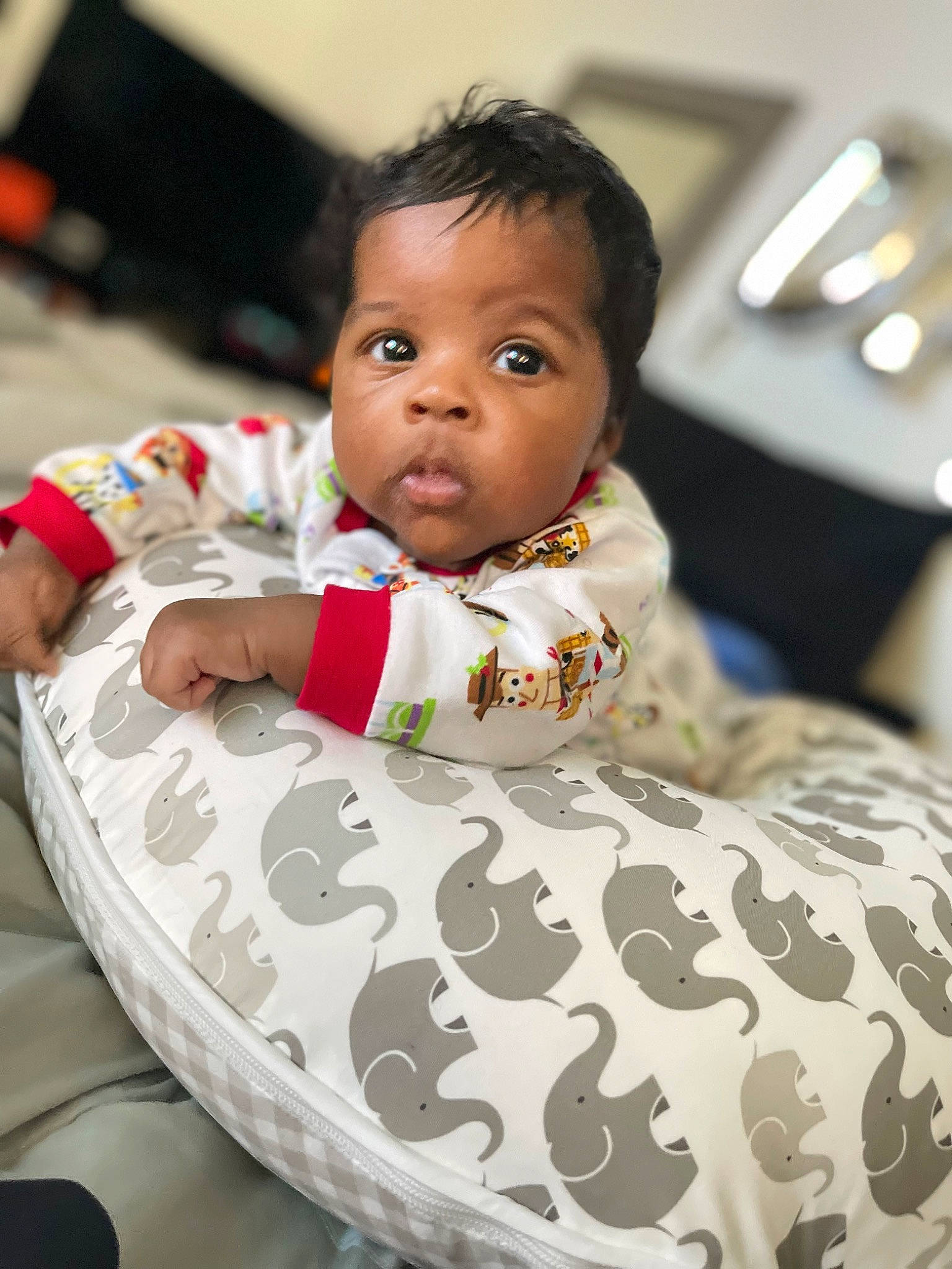 Ashton is registered to the contest to win money with this photo: baby, baby_toddler_clothing, chair, cheek, child, chin, comfort, eye, face, facial_expression, flash_photography, flooring, fun, happy, head, house, person, sitting, skin, toddler