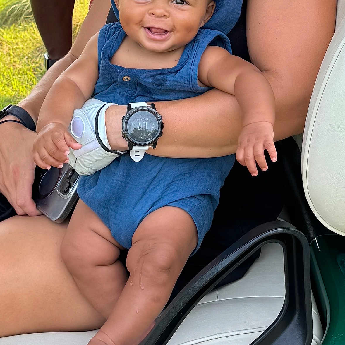 Roman is registered to the contest to win money with this photo: accessories, baby, bodypart, clothing, face, finger, footwear, hand, happy, hat, head, person, photography, portrait, shoe, shorts, sitting, smile, summer, wristwatch