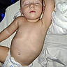 baby, sleeping, diaper, bed, blanket, sheet, infant, child, peaceful, resting, skin, naked_torso, indoors, soft, young, cute, toddler, relaxed, lying_down, peace