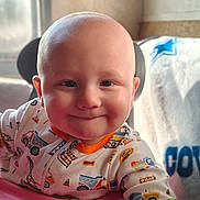 Zaidyn joined the competition — help win amazing prizes! baby, child, smiling, onesie, baby_walker, indoor, window, blanket, face, head, person, happy, seated, toy, colorful, clothing, infant, portrait, phone_screen, technology