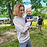 Zaidyn joined the competition — help win amazing prizes! baby, blue_sky, casual_clothing, child, cloud, curious, garden, grass, greenery, holding, hoodie, man, nature, outdoor, person, shed, shorts, tree, walking, young_person
