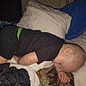 Zaidyn is registered to the contest to win money with this photo: toddler, sleeping, child, bed, pillow, blanket, black_clothing, indoor, rest, peaceful, cozy, soft_lighting, head, arm, hand, fabric, comfort, nap, young_child, home