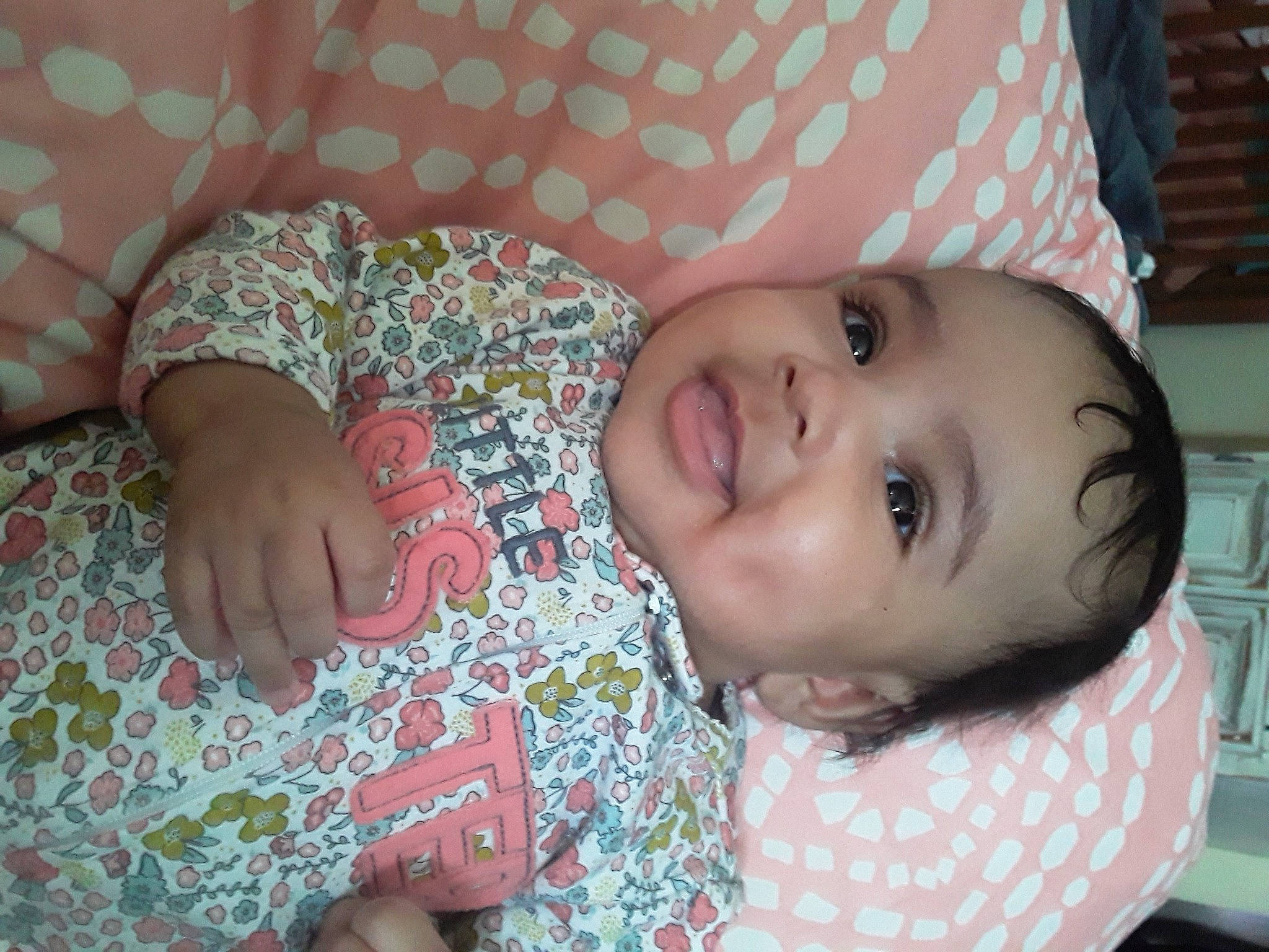 Imani is registered to the contest to win money with this photo: baby_toddler_clothing, cheek, clothing, comfort, eyebrow, eyelash, face, finger, forehead, happy, iris, joy, lip, mammal, mouth, nose, organ, person, pink, skin