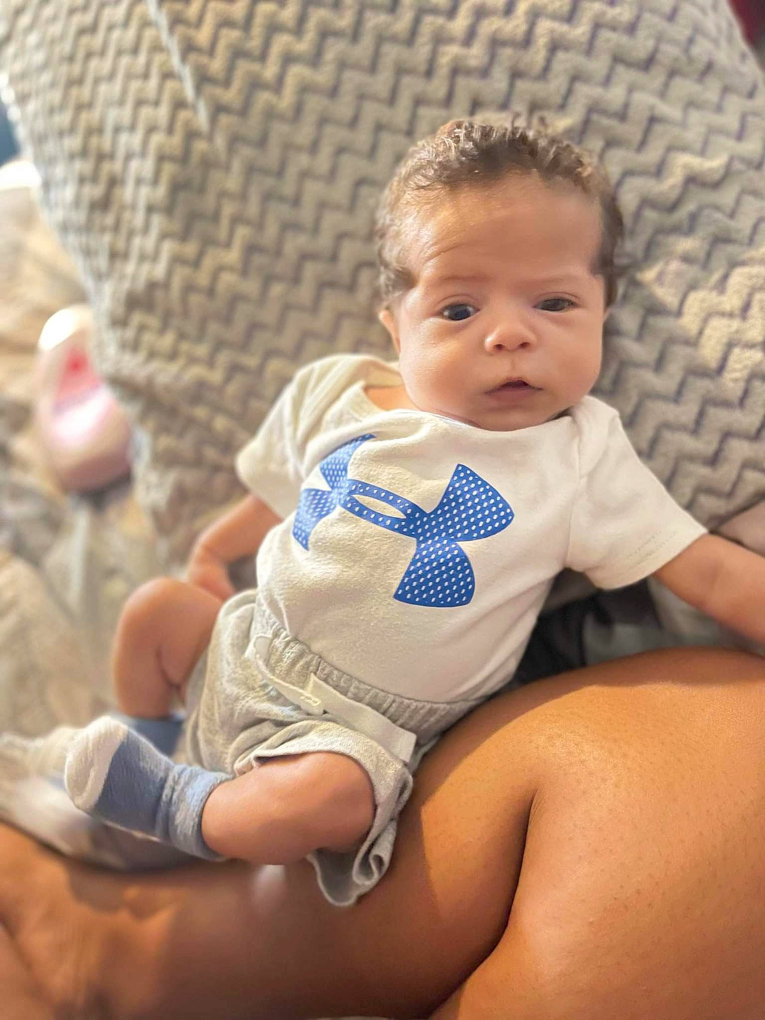 Zyler is registered to the contest to win money with this photo: abdomen, baby, baby_toddler_clothing, cheek, child, comfort, elbow, eye, face, finger, hairstyle, happy, human_body, human_leg, knee, person, skin, stomach, thigh, toddler