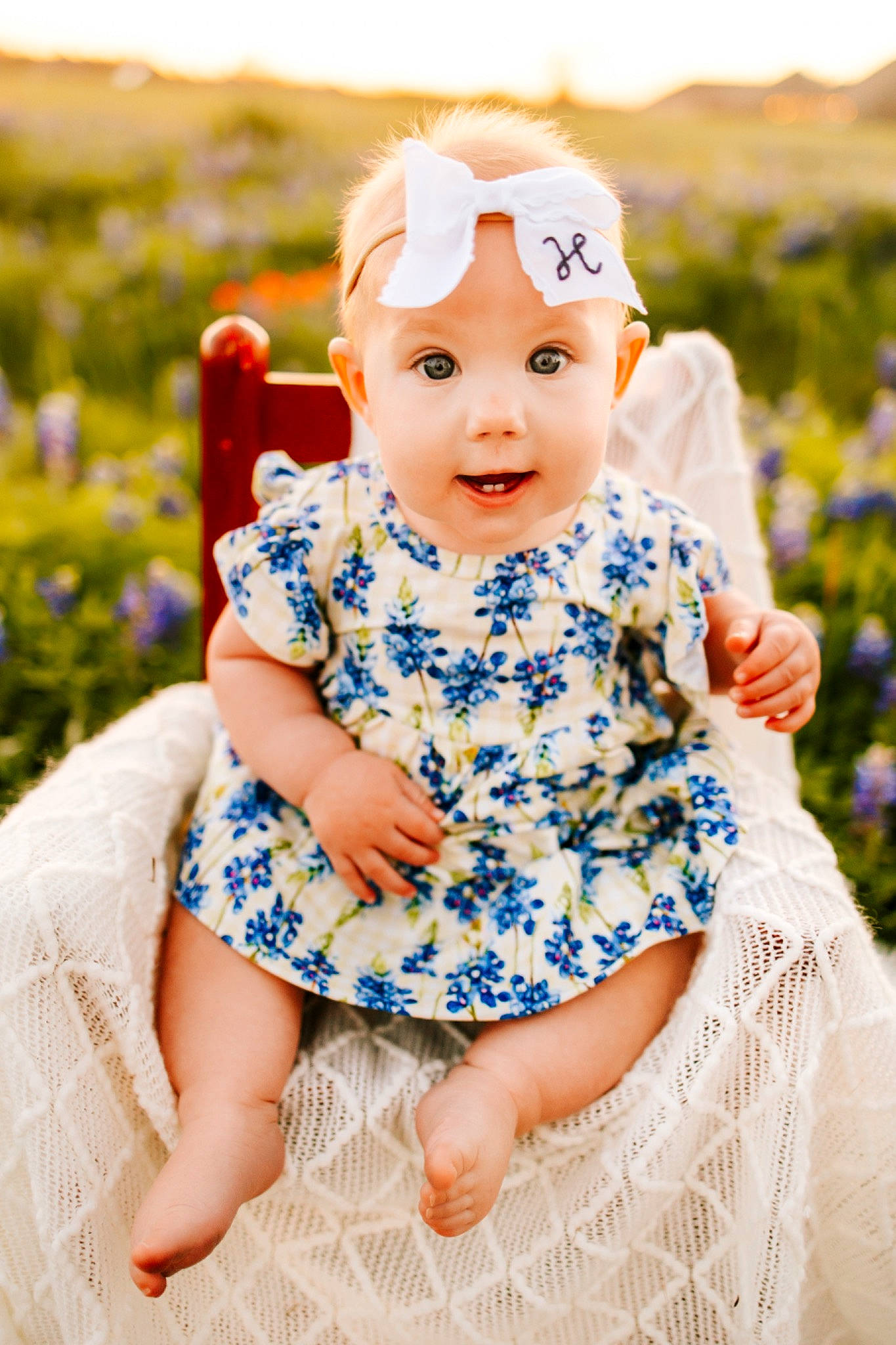 Hattie is registered to the contest to win money with this photo: azure, baby_toddler_clothing, facial_expression, flash_photography, grass, happy, hat, headwear, iris, one_piece_garment, outerwear, people_in_nature, person, pink, plant, purple, skin, sleeve, smile, standing