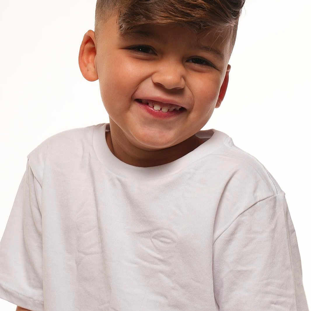 Norberto joined the competition — help win amazing prizes! boy, casual, child, cute, face, fashion, happy, headshot, innocent, kid, light_skin, person, portrait, positive, short_hair, smiling, studio, white_tshirt, young, youth