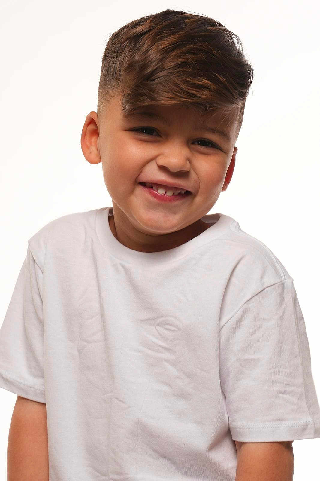 Norberto joined the competition — help win amazing prizes! child, boy, smiling, white_tshirt, portrait, short_hair, happy, cute, studio, young, fashion, casual, innocent, light_skin, person, headshot, face, kid, positive, youth