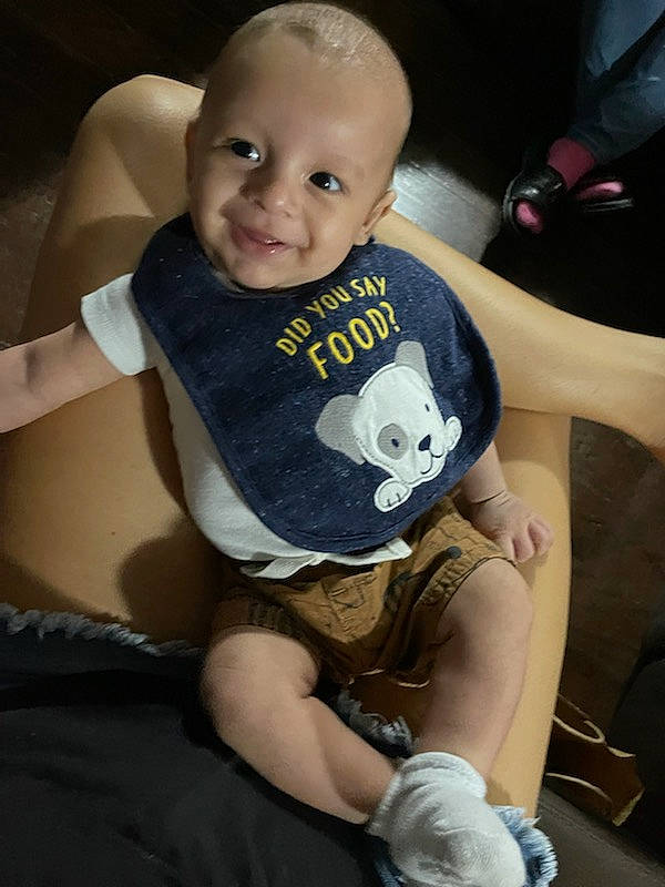 Maverick is registered to the contest to win money with this photo: arm, baby, baby_toddler_clothing, cheek, chin, comfort, eye, face, hair, hairstyle, hand, head, joint, joy, leg, mouth, neck, person, seat_belt, shoulder