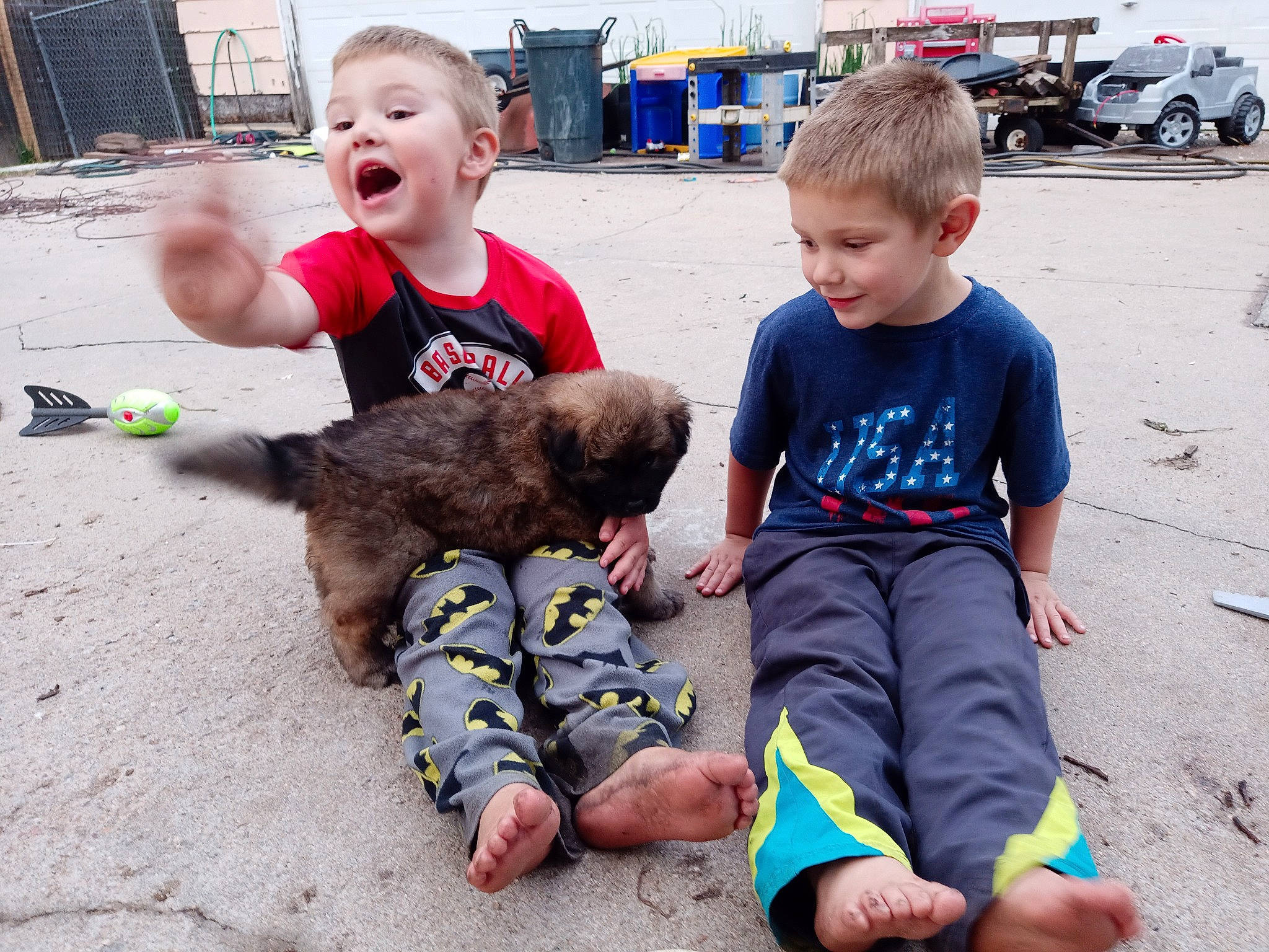 Curly is registered to the contest to win money with this photo: baby, barefoot, child, event, foot, fun, happy, leisure, play, recreation, sand, shorts, sitting, smile, summer, t_shirt, toddler, toy, vacation, wheel