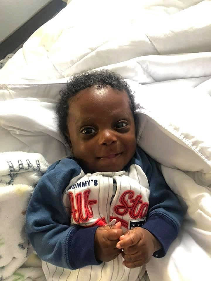 Kylen is registered to the contest to win money with this photo: baby, baby_toddler_clothing, cheek, child, comfort, finger, hand, linens, person, thumb, toddler