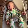 Luciano joined the competition — help win amazing prizes! baby, child, onesie, caterpillar_pattern, baby_chair, mesh_fabric, smiling, happy, indoor, sunlight, shadow, bedroom, pillow, seated, infant, cute, comfort, playful, person, portrait
