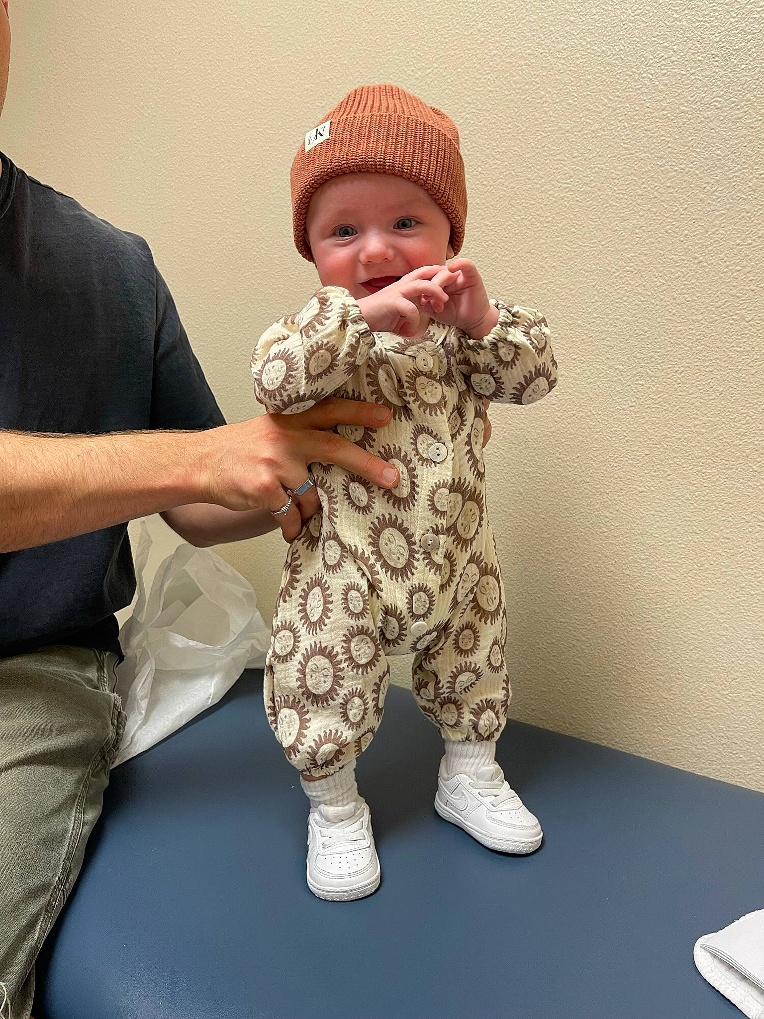 Bishop joined the competition — help win amazing prizes! baby, baby_toddler_clothing, cap, child, clothing, comfort, facial_expression, finger, fun, gesture, hand, happy, hat, headwear, human_body, human_leg, person, skin, sleeve, smile