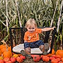 Jaxson is registered to the contest to win money with this photo: child, toddler, swing, pumpkin, pumpkin_patch, cornfield, boots, orange_shirt, outdoor, fall, autumn, smiling, cute, young_child, nature, play, seasonal, harvest, fun, holiday