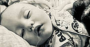 Simon joined the competition — help win amazing prizes! baby, bed, blanket, child, clothing, comfort, cozy, cute, face, indoors, infant, monochrome, nap, onesie, peaceful, portrait, rest, sleeping, soft, toddler