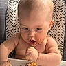 baby, child, high_chair, food, messy, eating, hands, face, mouth, skin, table, tray, indoor, meal, expression, cute, infant, feeding, person, closeup