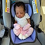 Rayne is registered to the contest to win money with this photo: baby, infant, car_seat, sleeping, mittens, pink_clothing, white_shirt, pacifier, floor_tiles, head_support, footwear, cute, child, small_hands, soft_fabric, indoors, toddler, resting, peaceful, curly_hair