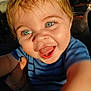 Shawn is registered to the contest to win money with this photo: baby, child, smiling, blue_eyes, closeup, happy, person, toddler, blue_shirt, striped_clothing, hand, face, portrait, sunlight, skin, mouth_open, outdoor, expression, cute, joy