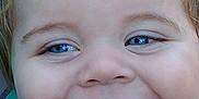 Shawn is registered to the contest to win money with this photo: baby, child, face, smile, blue_eyes, closeup, happy, innocence, skin, cheeks, mouth, expression, portrait, young_child, cute, messy, person, toddler, hair, outdoor