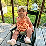 baby, child, girl, bow, dress, rocking_chair, wooden_porch, outdoor, greenery, sunny, grass, trees, fence, cute, infant, socks, smiling, person, summer, daytime
