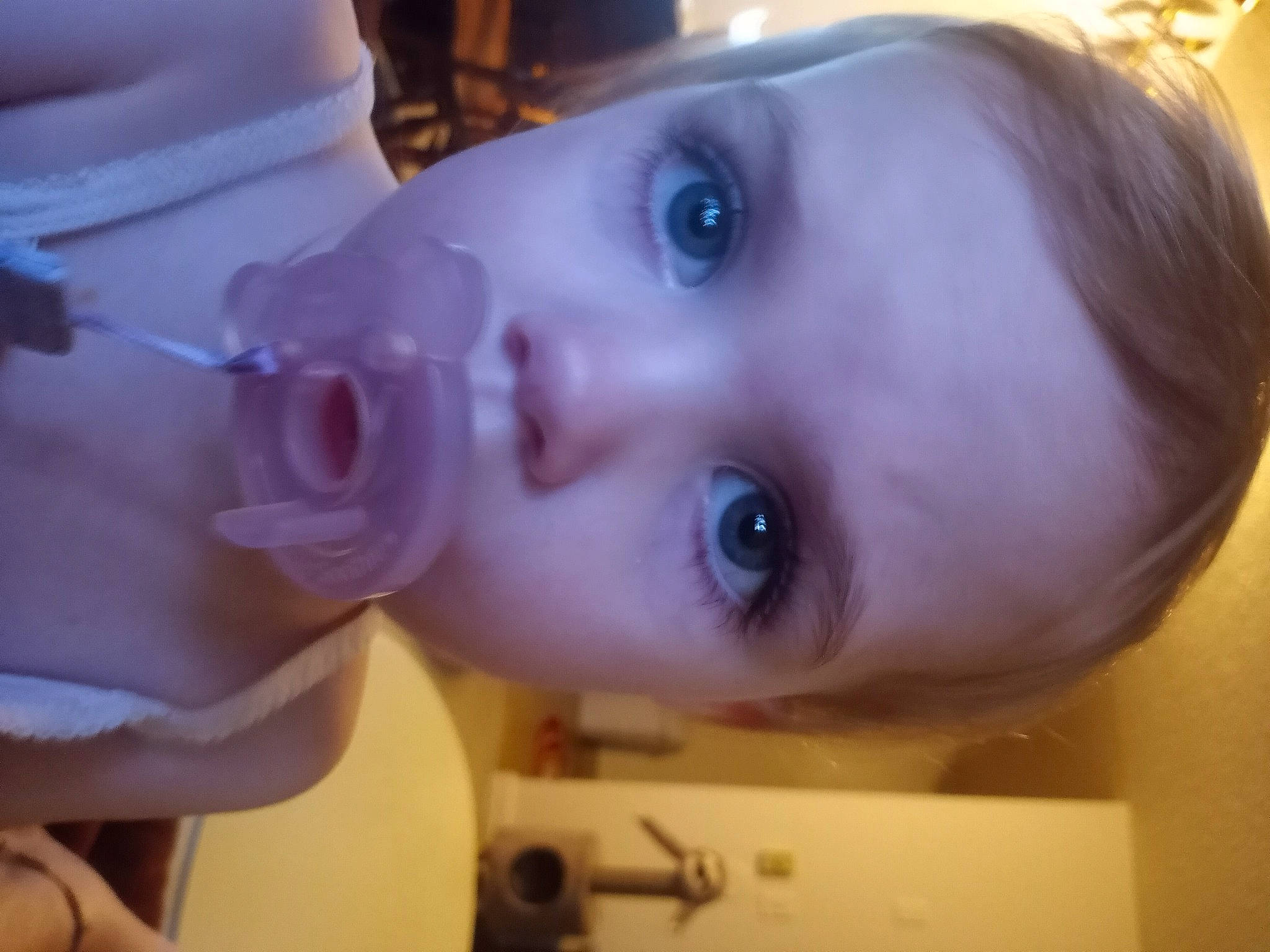 Ensley is registered to the contest to win money with this photo: black_hair, cheek, chest, ear, eye, eyelash, face, forehead, head, human_body, iris, jaw, lip, mouth, neck, nose, person, purple, skin, smile