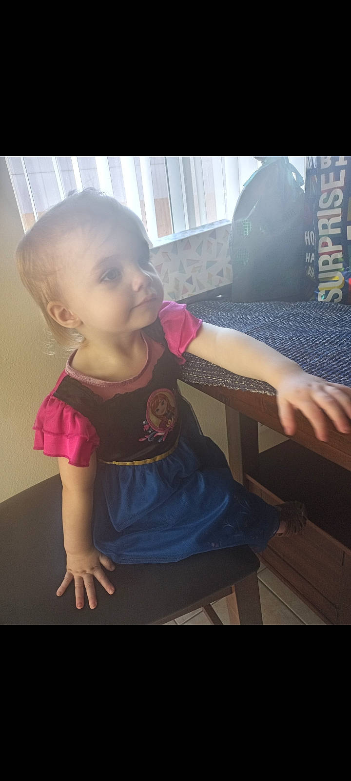 Ensley joined the competition — help win amazing prizes! baby, baby_toddler_clothing, dress, eyebrow, eyelash, fashion, finger, gesture, hand, happy, iris, lip, mammal, mouth, neck, person, shoulder, skin, sleeve, standing