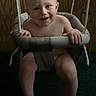 Ledger joined the competition — help win amazing prizes! baby, child, infant, smiling, sitting, swing, hanging_swing, indoor, portrait, barefoot, happy, face, wood_paneling, ropes, padded_seat, playground_equipment, baby_swing, legs, home, photography